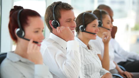 Business-workers-talking-on-headsets