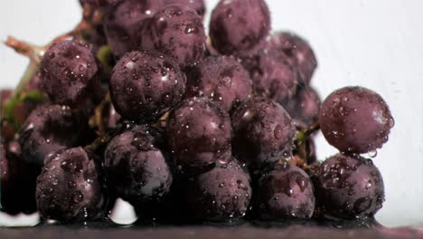 Bunches-of-grapes-in-super-slow-motion-being-wet