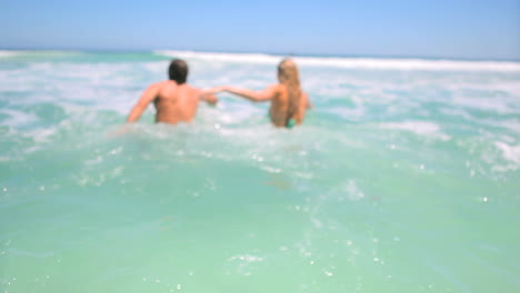 Couple-swimming-together-