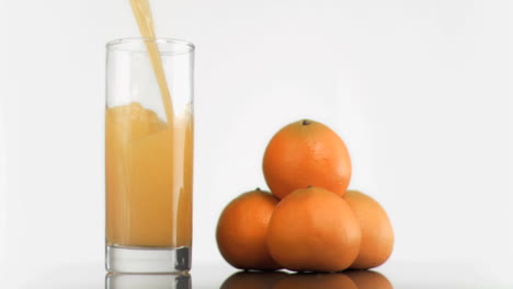 Orange-juice-been-poured-in-super-slow-motion