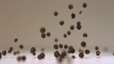 Black-peppercorns-falling-in-super-slow-motion