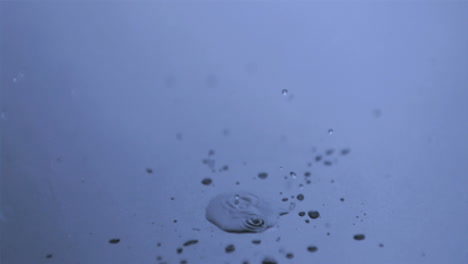 Raindrop-in-super-slow-motion-falling-in-a-puddle
