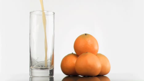 Fresh-orange-juice-poured-in-super-slow-motion