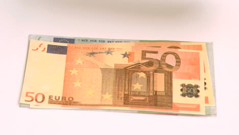 Wind-blowing-in-super-slow-motion-to-show-one-hundred-euro-banknotes-