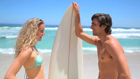 Blonde-flirting-with-a-surfer