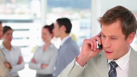 Businessman-talking-on-his-mobile-phone