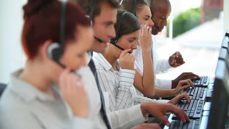 Business-workers-talking-on-headsets