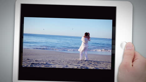 Happy-couple-standing-together-on-the-beach