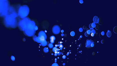 Blue-bubbles-floating-in-super-slow-motion-in-the-air