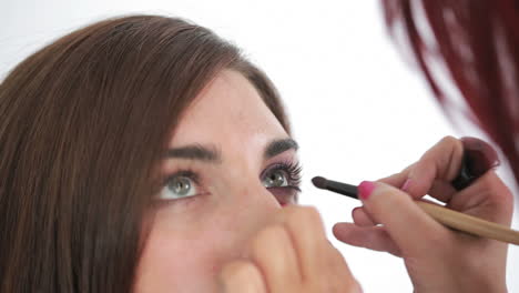 Woman-getting-applied-cat-eyes