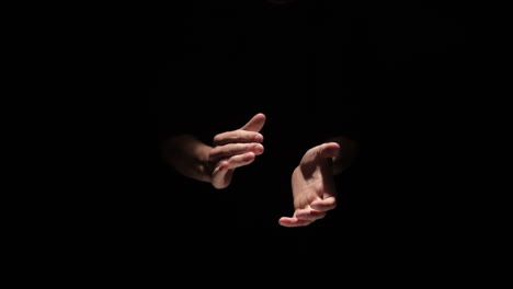 Hands-clapping-on-black-background