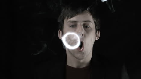 Man-blowing-smoke-rings