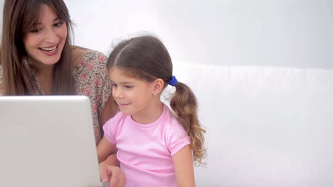 Mother-and-daughter-using-laptop