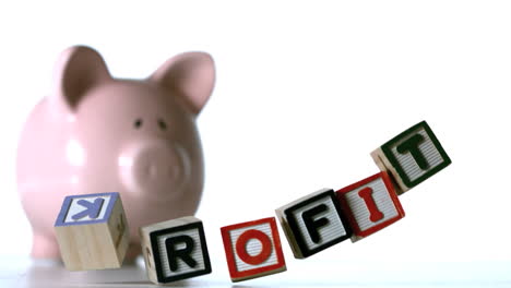 Profit-spelled-out-in-block-letters-dropping-down-