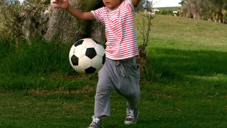 Child-playing-football