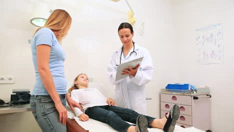 Daughter-and-mother-with-a-doctor-in-a-hospital