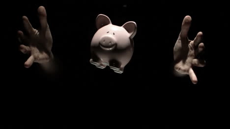 Mans-hands-tossing-pink-piggy-bank-