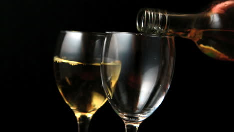 Two-glasses-of-white-wine-being-poured