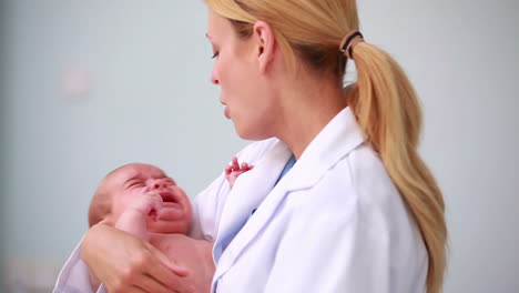 Doctor-holding-a-new-born-baby