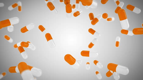 White-and-orange-pills-falling