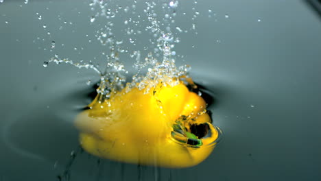 Yellow-pepper-falling-in-water-