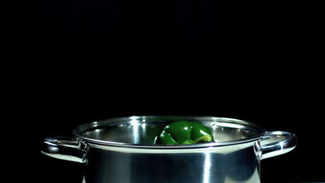 Green-pepper-falling-into-saucepan