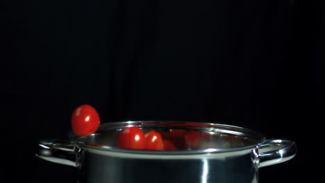 Tomatoes-falling-into-saucepan