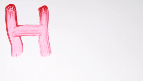 Hand-painting-HIV-in-red-paint