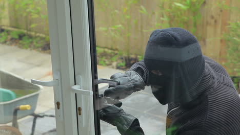 Burglar-breaking-open-the-door