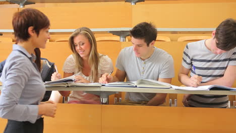 Students-sitting-at-the-desk-at-the-lecture-hall-
