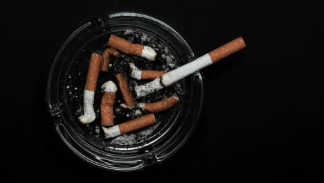 Cigarette-burning-in-ashtray