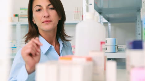 Woman-looking-at-a-box-of-tablets