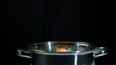 Egg-falling-into-saucepan