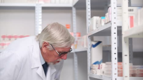 Pharmacist-writing-on-his-clipboard