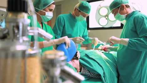 Surgeons-working-with-a-scissors-on-a-patient