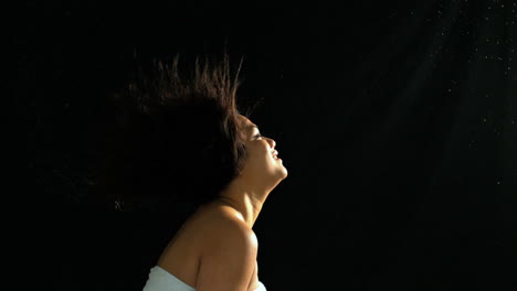 Smiling-woman-shaking-her-wet-hair-