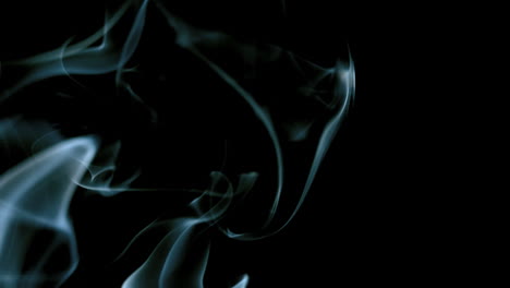 White-smoke-moving-across-black-background