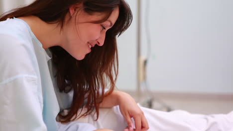 Joyful-mother-standing-on-top-of-a-new-born-baby