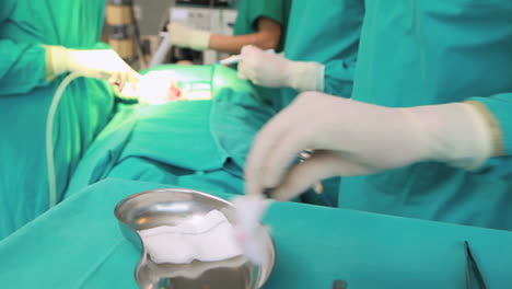 Female-patient-lying-on-a-table-undergoing-surgery