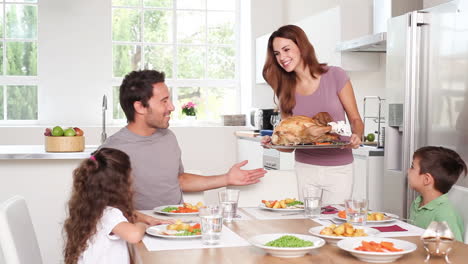 Mother-taking-chicken-dish-to-her-family-