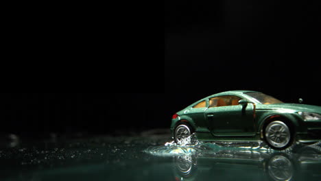 Toy-car-rolling-over-water