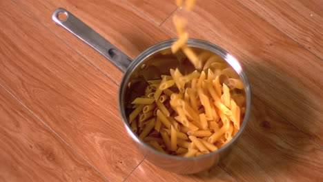 Penne-falling-into-pot-