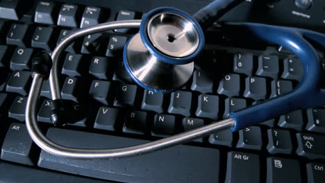 Stethoscope-falling-onto-computer-keyboard