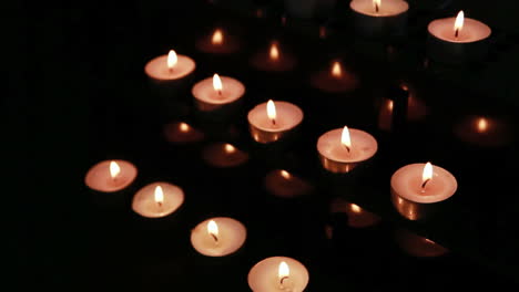 Candles-at-an-alter-being-blown-out