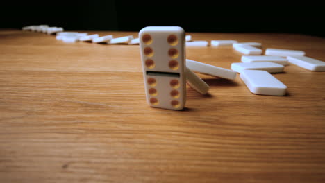 The-domino-effect-on-wooden-table