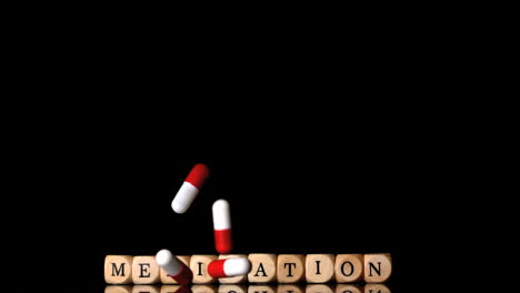 Capsule-tablets-falling-in-front-of-dice-spelling-medication