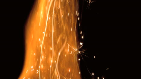 Close-up-of-flame-with-sparks