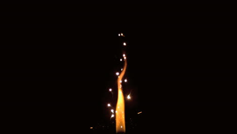 Growing-flame-with-sparks-on-black-background