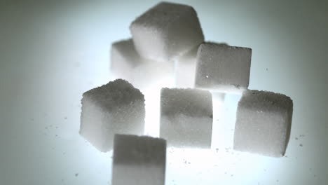 Sugar-cube-falling-onto-pile-of-cubes