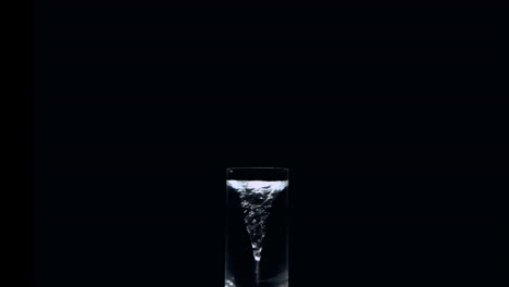 Whirlpool-in-a-glass-of-water-on-black-background